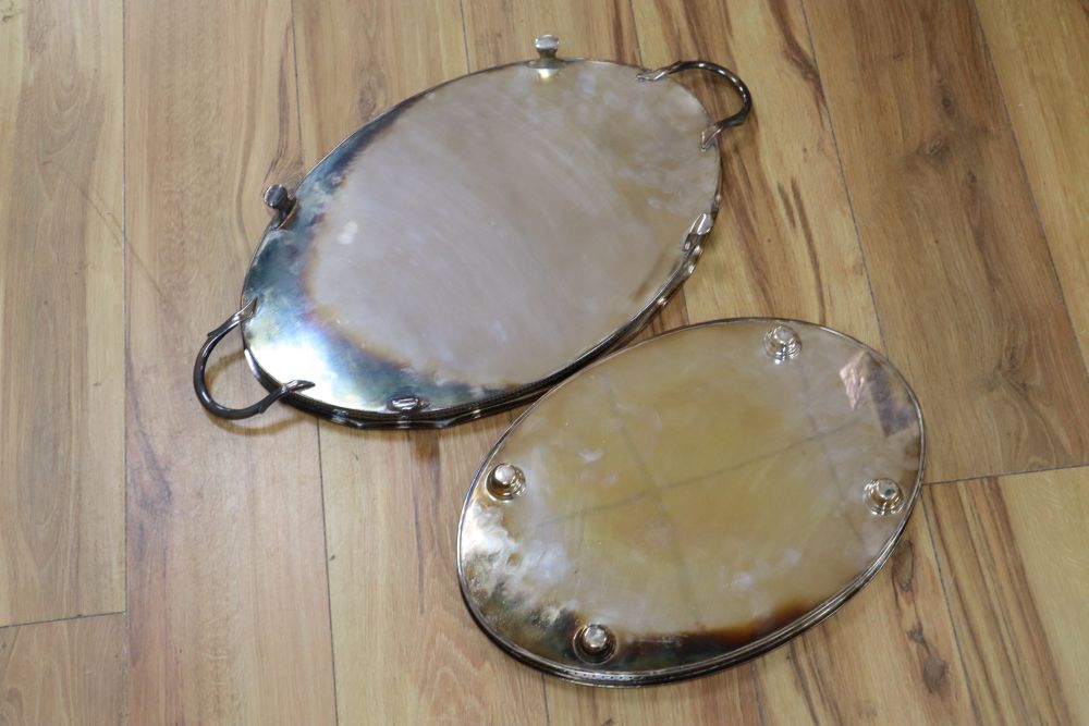 An oval two handled plated tray on lion paw feet, and another tray, largest 57cm